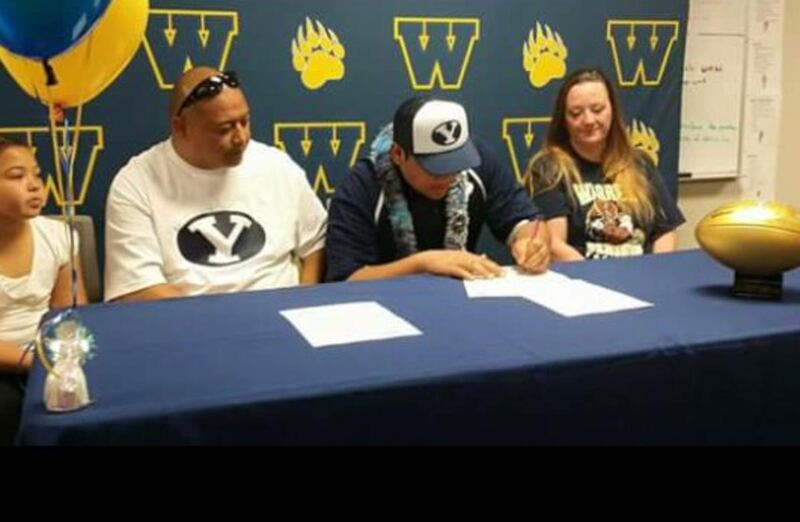 Defensive lineman Kainoa Fuiava signs his letter of intent to play football at BYU.