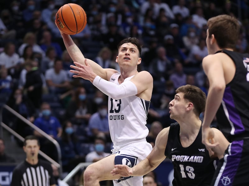 BYU’s Alex Barcello drives on Portland guard Matija Svetozarevic in Provo on Saturday, Jan. 22, 2022.
