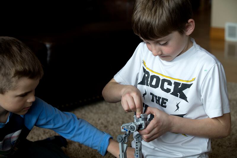 Ryan Nelson, left, and Jonah Greenwell play with Legos at the Greenwell's home in Park City on Friday, March 16, 2018.