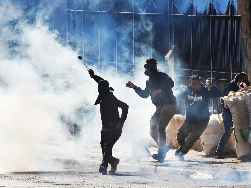 Palestinians clash with Israeli troops during a protest against U.S. President Donald Trump's decision to recognize Jerusalem as the capital of Israel in the West Bank city of Bethlehem, Friday, Dec.8, 2017.(AP Photo/Nasser Shiyoukhi)