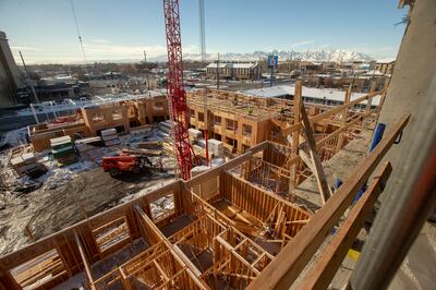 FILE - Construction workers work at the Garden Lofts, an affordable housing project being built in Salt Lake City, on Friday, Dec. 28, 2018.
