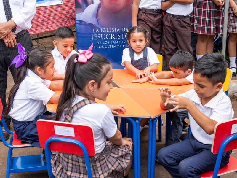 Students in Escuintla, Guatemala, sit at their new desks on July 25, 2025, after a donation from The Church of Jesus Christ of Latter-day Saints.