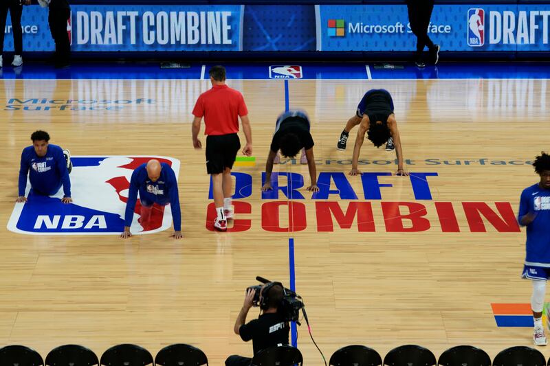 Participants warm up on the court during the 2023 NBA basketball draft combine in Chicago, Wednesday, May 17, 2023.