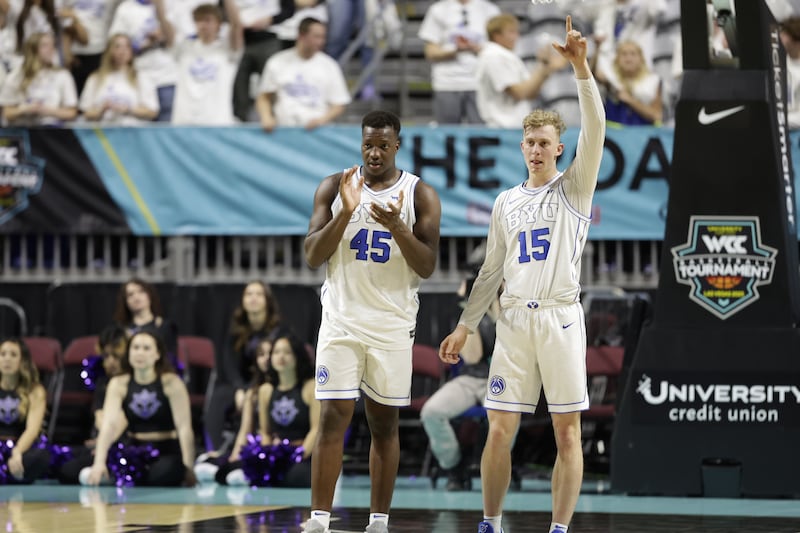 Fousseyni Traore (45) and Richie Saunders (15) clap.