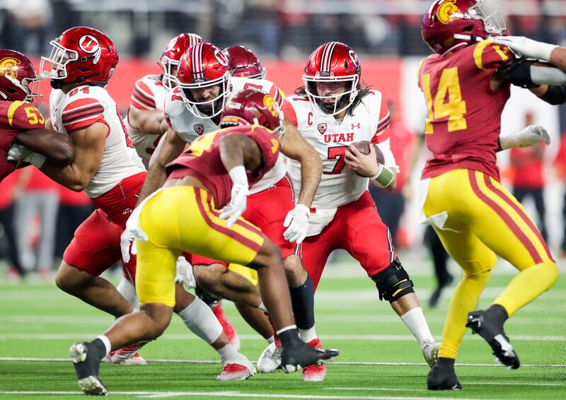 Utah quarterback Cam Rising looks for an opening during the Pac-12 championship game against USC in at Allegiant Stadium.