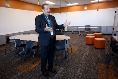Farmington High School Principal Richard Swanson gives a tour of a classroom in the new school on Thursday, July 12, 2018. Classrooms have furniture that can be arranged many different ways.