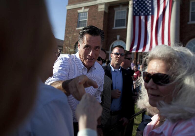Republican presidential candidate, former Massachusetts Gov. Mitt Romney shakes hands during a campaign stop at William Jewell College on Tuesday, March 13, 2012, in Liberty, Mo.