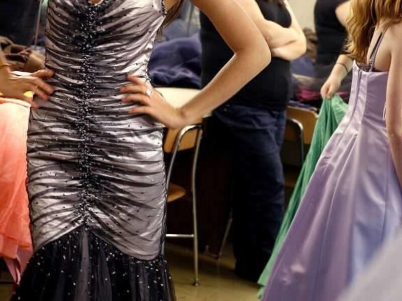Angelica Arias, 12th grade, is all smiles in her "new" prom gown that was donated through the Young Lawyers Division of Utah at Cottonwood High School on Thursday, February 10, 2011.