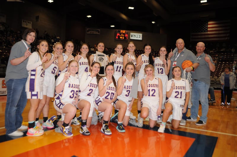 Wayne High School players celebrate after earning their first state trophy in 19 years Saturday, March 4, 2023, in Richfield.