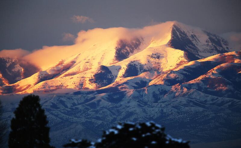 The Oquirrh Mountains are lit by the early sunrise in Salt Lake County on Wednesday, Nov. 30, 2016.