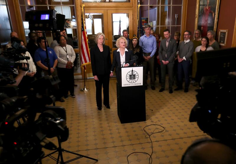 Betty Iverson holds hands with her wife, Salt Lake City Mayor Jackie Biskupski, as Biskupski announces her withdrawal from the mayoral race during a press conference at the City-County Building on Monday, March 18, 2019. Biskupski said the decision was du