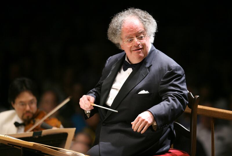 FILE - In this July 7, 2006 file photo, Boston Symphony Orchestra music director James Levine conducts the symphony on its opening night performance at Tanglewood in Lenox, Mass. The Metropolitan Opera says it found credible evidence that conductor James