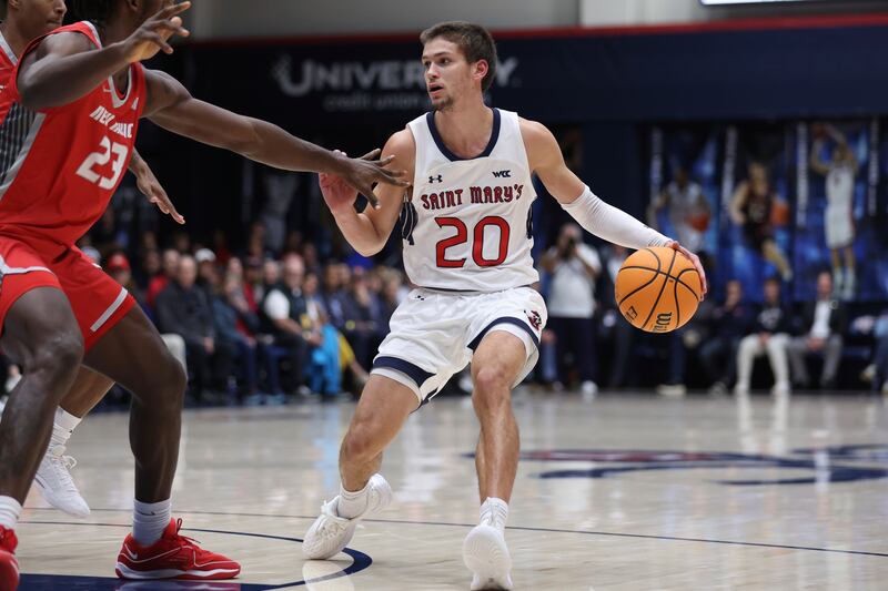 Saint Mary’s guard Aidan Mahaney (20) drives against New Mexico during the first half of an NCAA college basketball game in Moraga, Calif., Thursday, Nov. 9, 2023.