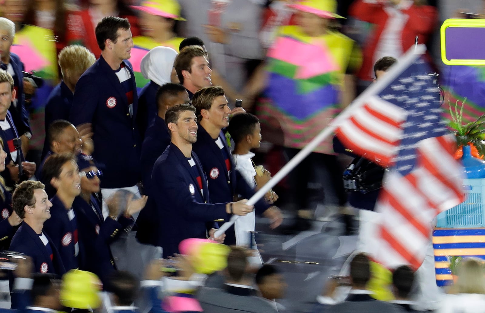 Michael Phelps carries the flag of the United States during the opening ceremony for the 2016 Summer Olympics.