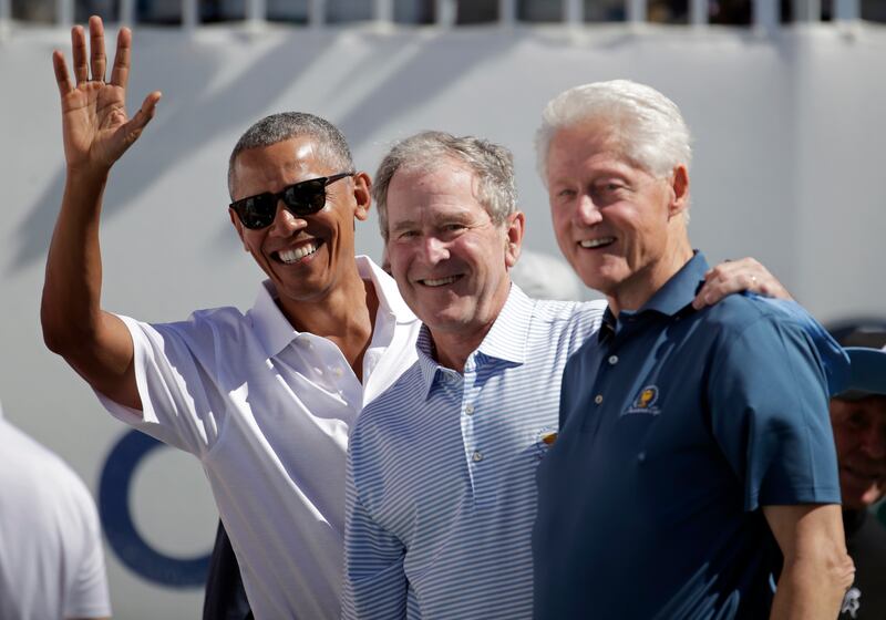 Former U.S. Presidents Barack Obama, left, George W. Bush and Bill Clinton.