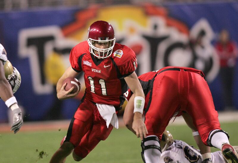 Utah quarterback Alex Smith runs through the Pitt Panthers defense during the 2005 Fiesta Bowl in Tempe, Ariz. on Jan. 1, 2005.