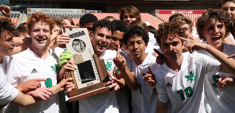 Rowland Hall players celebrate their win over St. Joseph’s in the 2A boys soccer state championship at Rio Tinto Stadium.