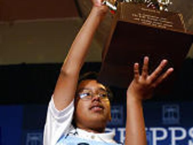Anurag Kashyap holds up his trophy after winning the National Spelling Bee in Washington on Thursday.