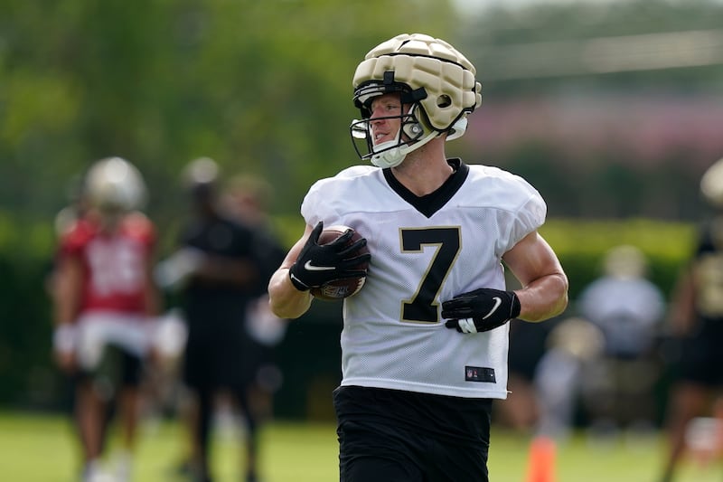 New Orleans Saints quarterback Taysom Hill (7) runs through drills during training camp.