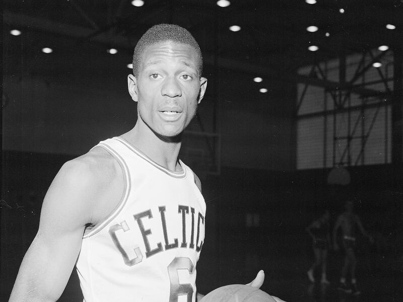 Bill Russell of San Francisco and the Olympic basketball team wears a Boston Celtics uniform for his first workout with the NBA team shortly after having signed a contract in Boston, Ma., on Dec. 19, 1956. (AP Photo)