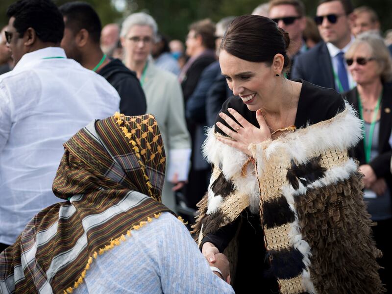In this photo supplied by the New Zealand government, New Zealand Prime Minister Jacinda Ardern meets members of the Muslim community following the national remembrance service for the victims of the March 15 mosques terrorist attack in Hagley Park, Chris