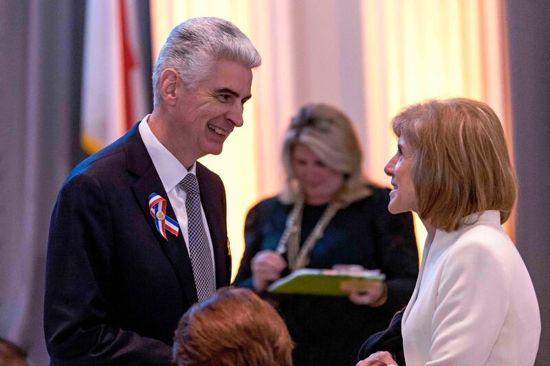 Bishop Gérald Caussé (left) talks to Gail J. McGovern, CEO and president of the American Red Cross (right), in Washington, D.C.
