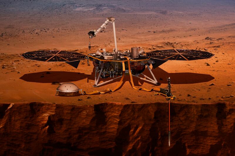 This illustration made available by NASA in 2018 shows the InSight lander drilling into Mars. InSight is short for Interior Exploration using Seismic Investigations, Geodesy and Heat Transport.