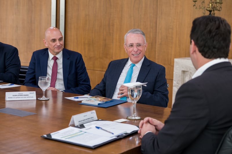 Elder Ulisses Soares of the Quorum of the Twelve Apostles, center, and Elder Ciro Schmeil — first couneslor in the Brazil Area presidency, left — talk with Paraná Governor Carlos Massa Ratinho Junior, right, in Curitiba, Brazil, Nov. 17, 2025.