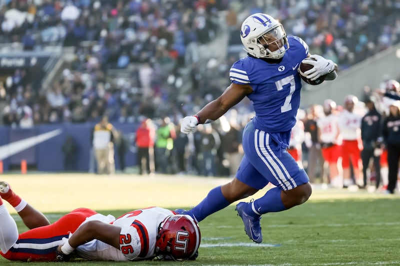 BYU Cougars running back Hinckley Ropati (7) carries the ball against Utah Tech at LaVell Edwards Stadium.