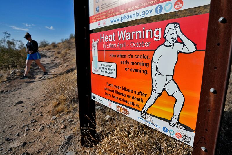 A hiker finishes her hike early to beat high temperatures in Phoenix.