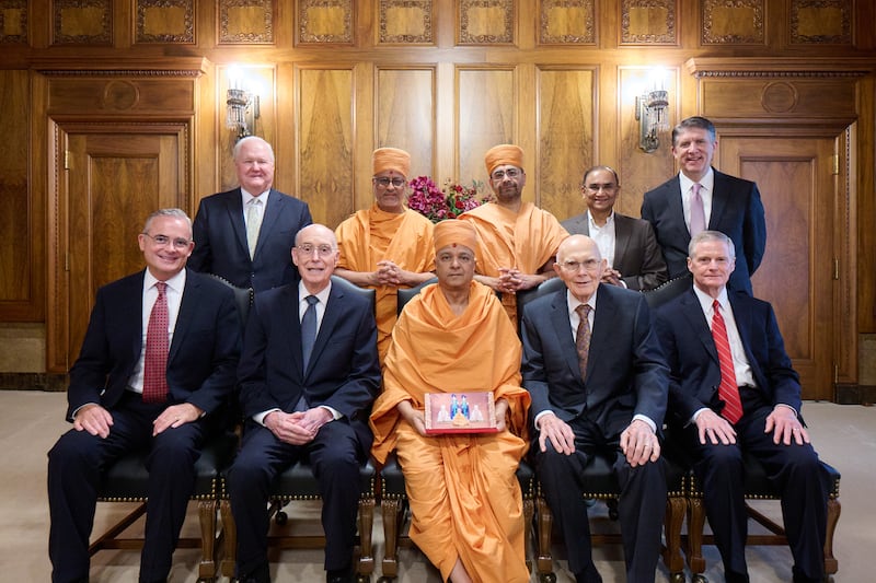 His Holiness Brahmavihari Swamiji, head of BAPS Hindu Mandir Abu Dhabi, pauses for a photo with members of the First Presidency and other senior leaders of The Church of Jesus Christ of Latter-day Saints in Salt Lake City, Utah, on Wednesday, June 18, 2025.