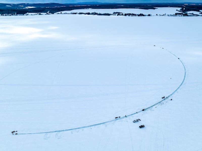 This photo provided by Aroostook UAS shows volunteers creating a giant ice carousel on a frozen lake on March 29, 2023, in Madawaska, Maine.