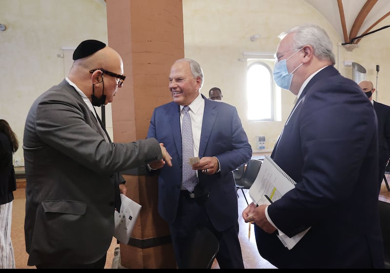 Elder Ronald A. Rasband and Elder Jack N. Gerard talk with Gady Gronich, CEO and chief of staff to the president of the Conference of European Rabbis Foundation.