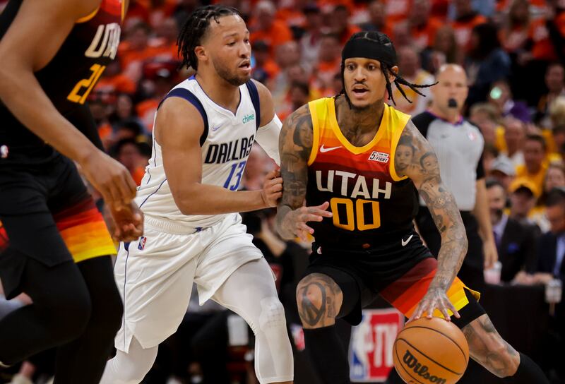 Dallas Mavericks guard Jalen Brunson (13) defends Utah Jazz guard Jordan Clarkson (00) as the Utah Jazz and Dallas Mavericks play an NBA basketball game at Vivint Arena in Salt Lake City on Thursday, April 21, 2022.