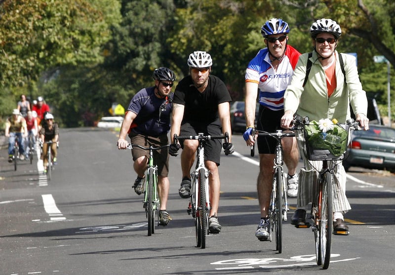 From left, Mark Puddy, Jared Ferguson, Jim Hopkin and Becka Roolf ride down 1500 East on Saturday, Sept. 17, 2011.