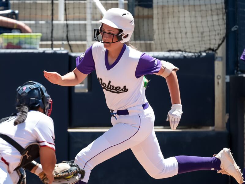 Riverton’s Jolie Mayfield, wearing white, runs the bases.