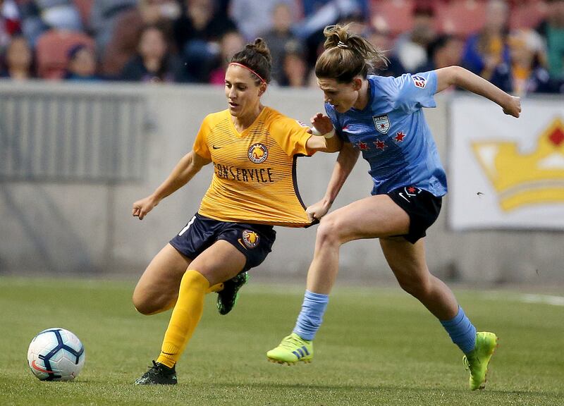 Utah Royals FC midfielder Vero Boquete keeps the ball from Chicago Red Stars defender Arin Gilliland at Rio Tinto Stadium in Sandy on Friday, May 3, 2019.