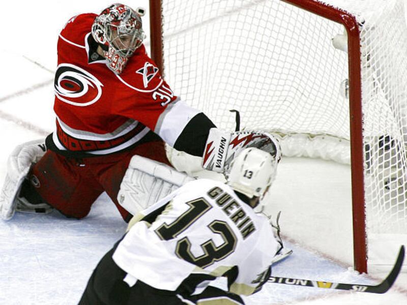 Carolina goalie Cam Ward can't stop a shot by Pittsburgh's Bill Guerin in the Penguins' Eastern Conference sweep.