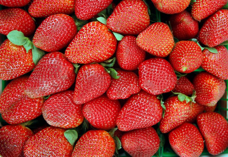 Fresh strawberries at the CJJ Farms stand at the Old Oakland Farmers’ Market in Oakland, Calif. Select frozen strawberry products have been recalled due to a possible hepatitis A contamination.