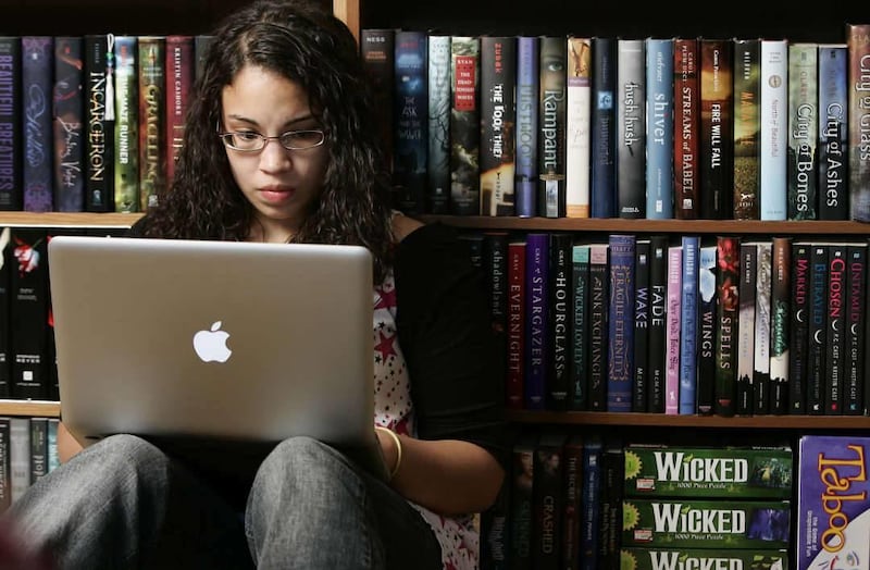 Young writer Evelyn Burdette, 19, of Kansas City, Kansas, has penned seven self-published books for young adult readers.