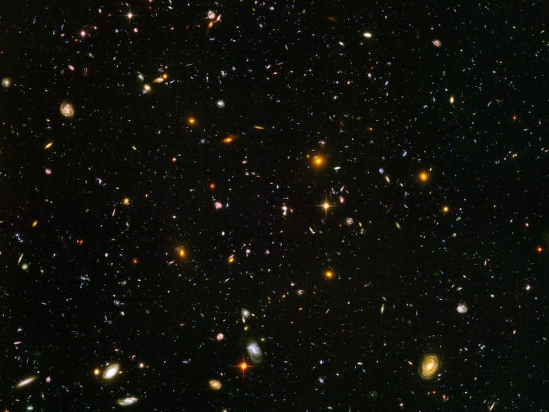 This image made from a composite of September 2003 - January 2004 photos captured by the NASA/ESA Hubble Space Telescope shows nearly 10,000 galaxies in the deepest visible-light image of the cosmos, cutting across billions of light-years. In research rel