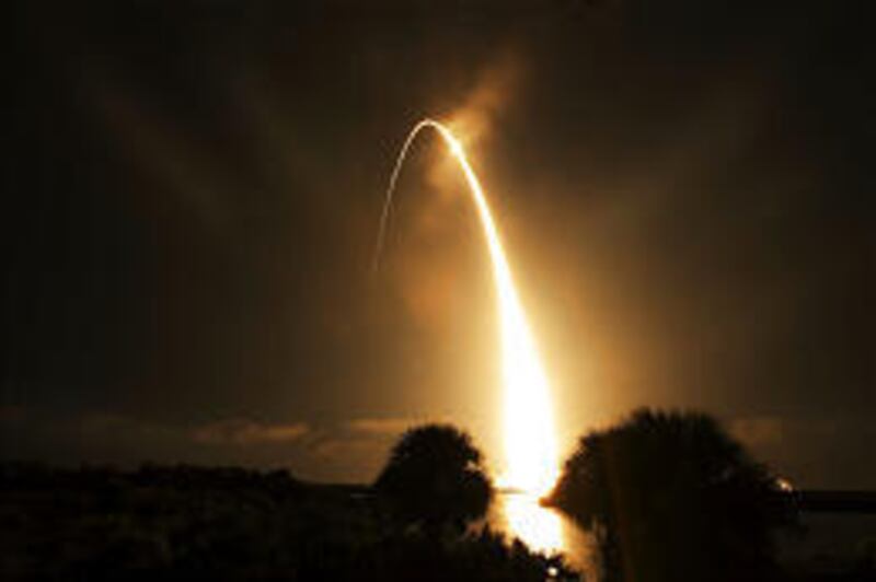 Discovery lifts off from Kennedy Space Center at Cape Canaveral on Saturday night. The shuttle is on a 12-day mission to the space station.