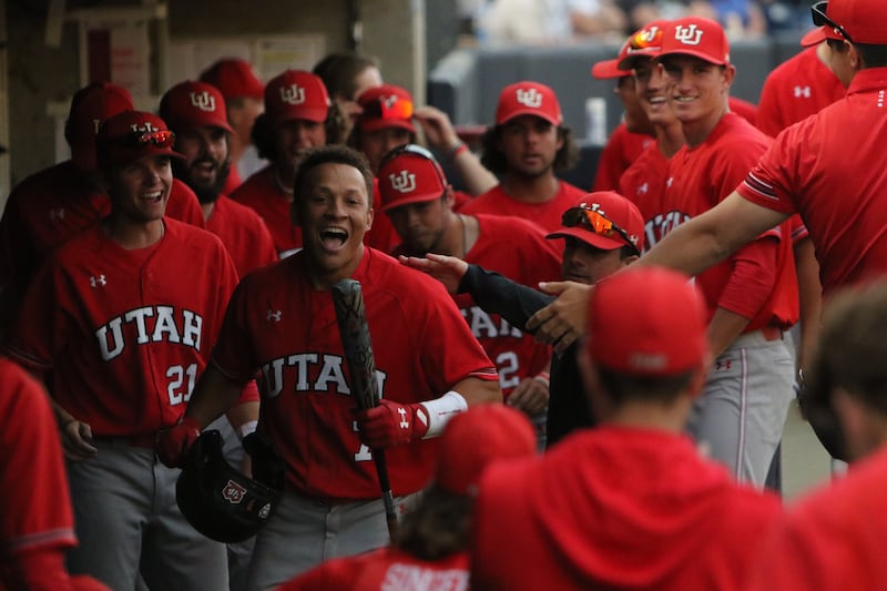 Utah’s Chase Anderson (7) celebrates with teammates during the Utes’ 12-7 victory over the BYU Cougars at Miller Park in Provo, Utah, on May 17, 2022.