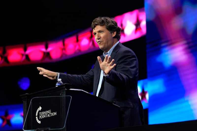 Tucker Carlson speaks at the Turning Point Action conference in West Palm Beach, Fla.