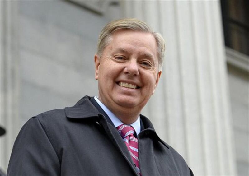 In this Jan. 14, 2015 file photo, Sen. Lindsey Graham, R- S.C., walks down the steps of the State Capitol building in Columbia, S.C.