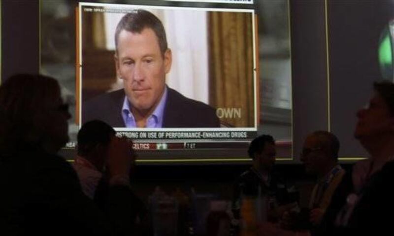A video screen at a hotel restaurant in Grapevine, Texas on Friday shows a replay telecast of a segment of Lance Armstrong being interviewed by Oprah Winfrey. Reversing more than a decade of denials, Armstrong confessed to using performance-enhancing drug