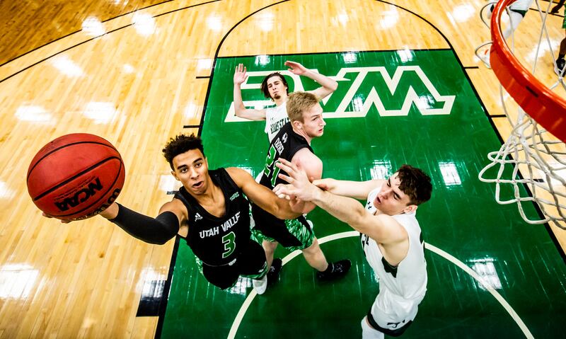 Utah Valley guard Blaze Nield (3) goes for a shot against an Adams State defender in the UCCU Center in Orem, Utah, in 2020.