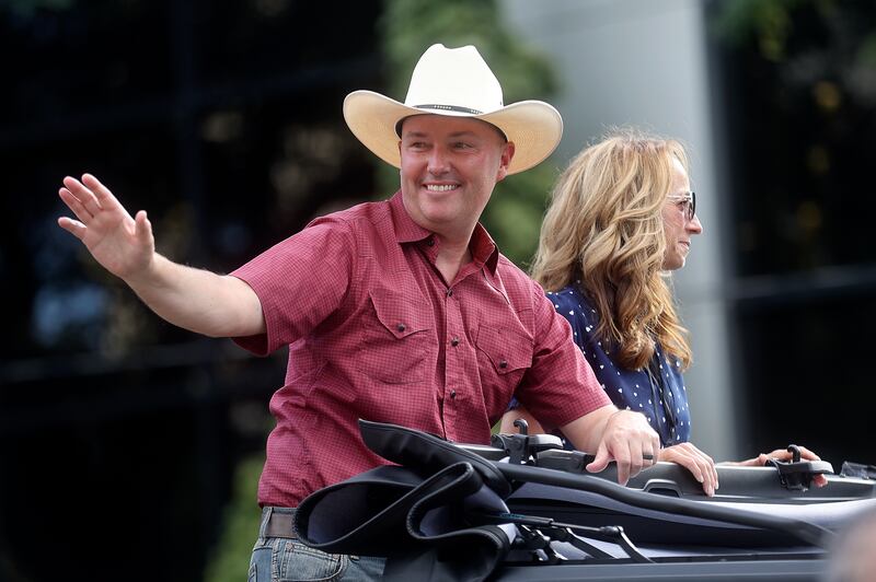 Gov. Spencer Cox and first lady Abby Cox ride in the Days of ’47 Parade in Salt Lake City.