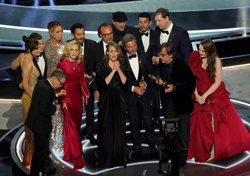 The cast and crew of “CODA” accept the award for best picture at the Oscars on Sunday, March 27, 2022, at the Dolby Theatre in Los Angeles.