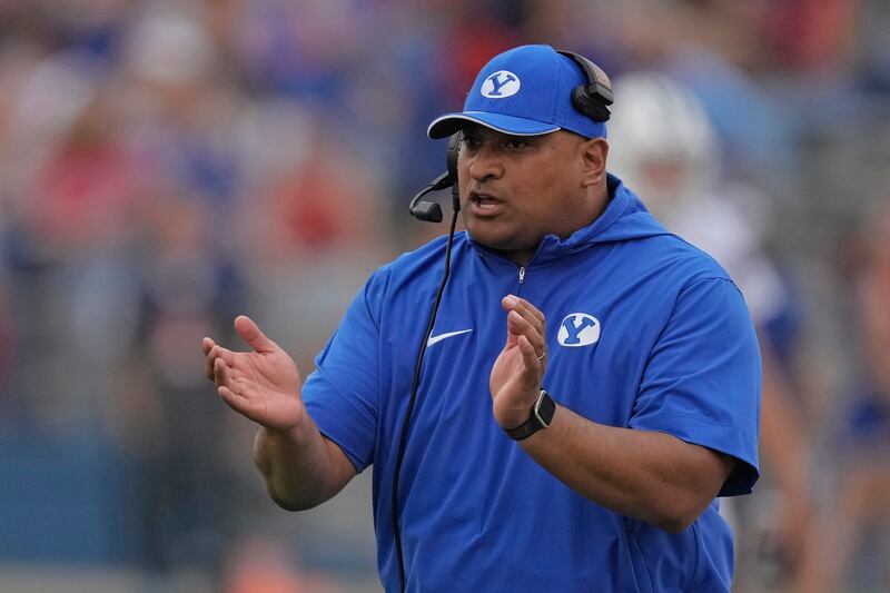 Coach Kalani Sitake talks to his team during a game against Kansas on Sept. 23, 2023, in Lawrence, Kan.